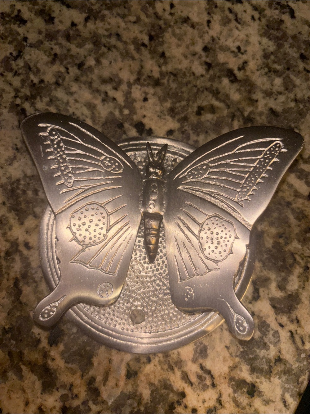 Engraved metal door ornament